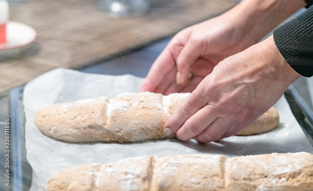 Woman preparing fresh bread at home in coronavirus times Woman preparing fresh bread at home in coronavirus times