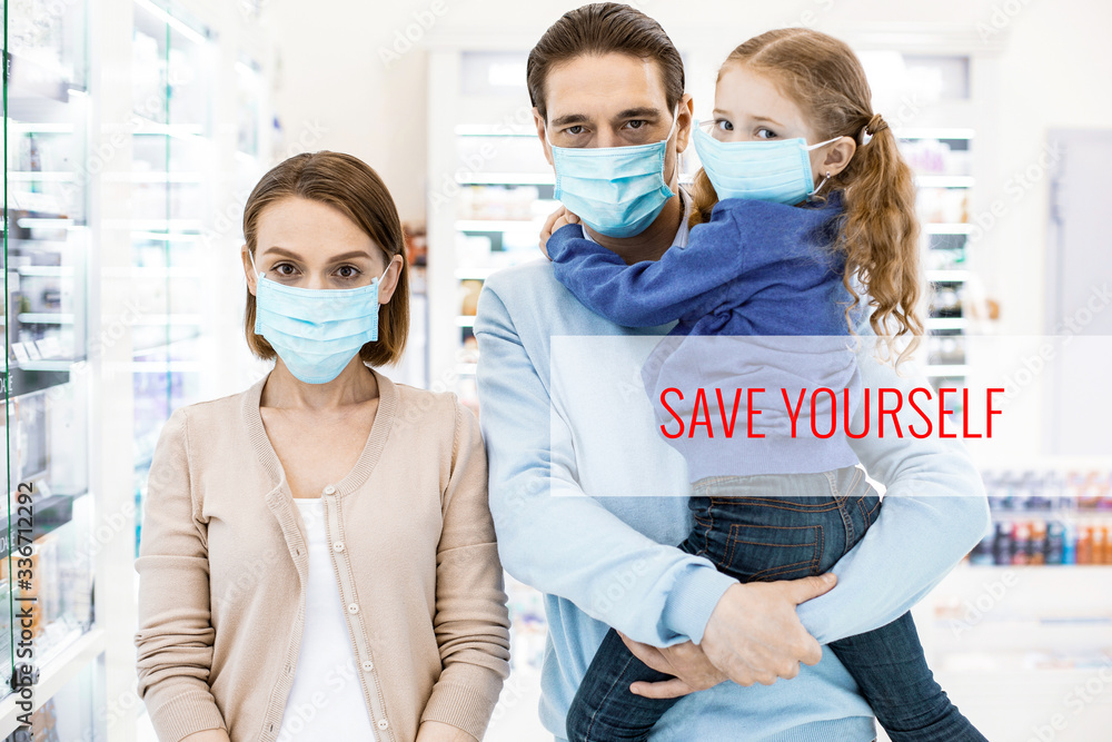 Unhappy family standing in a drugstore wearing protective masks