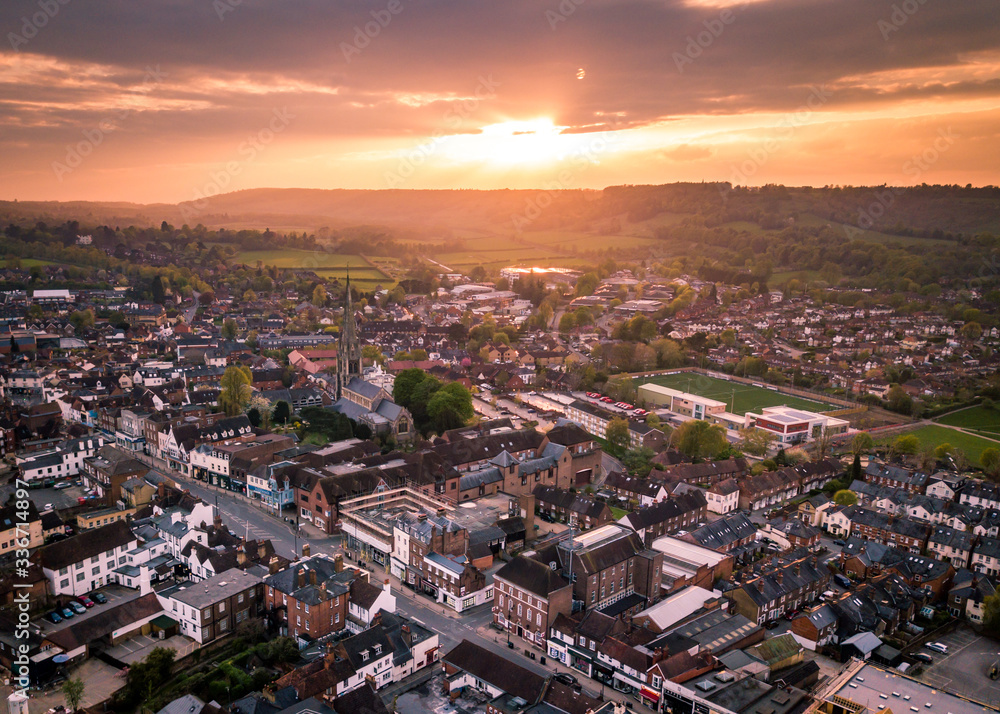 England, UK- Sun setting over a typical English town in Surrey