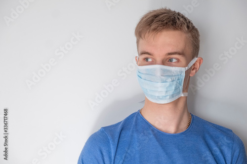Man in medical mask on white background. Text space