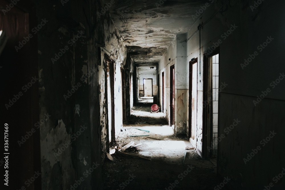 Abandoned building corridors with an eerie atmosphere. Dark tourism concept image. Abandoned building corridors with an eerie atmosphere. Dark tourism concept image.