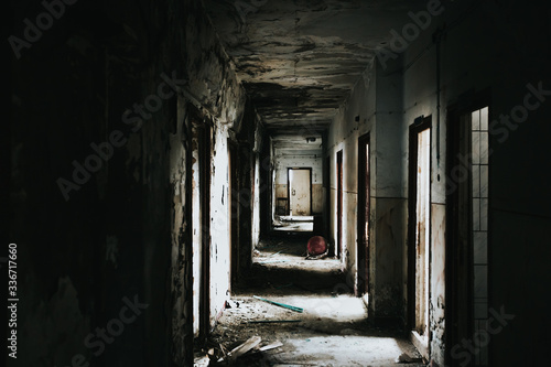 Abandoned building corridors with an eerie atmosphere. Dark tourism concept image. 