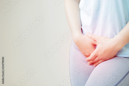 Woman having a stomachache, or menstruation pain. suffering from abdominal. Menstrual cramps. Healthcare and medical, gynecology concept. illness painful area highlight in red.