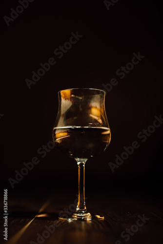 Glass of water or wine in a dark background