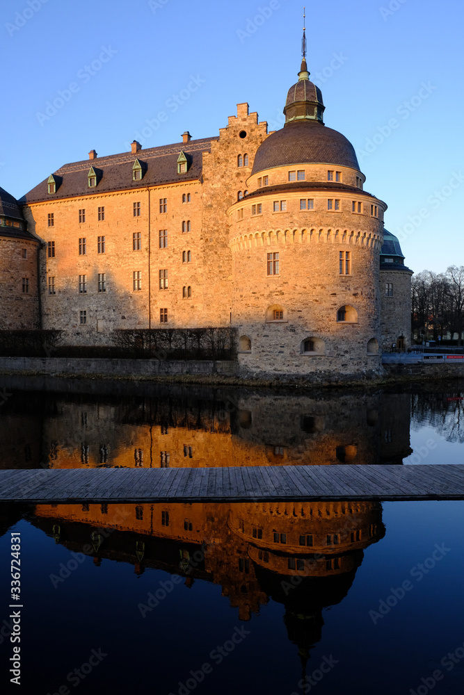 Orebro castle and reflection at sunset, Orebro, Sweden