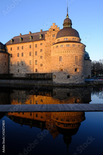 Vászonkép Orebro castle and reflection at sunset, Orebro, Sweden