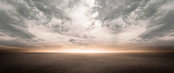 Dark Concrete Floor Background with Scenic Night Sky Horizon and Dramatic Clouds