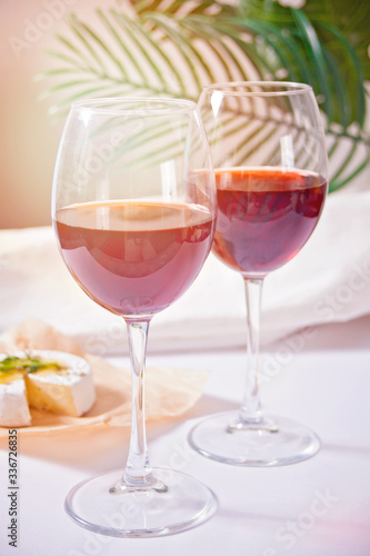 Two glasses with red grape wine. Romantic dinner concept.