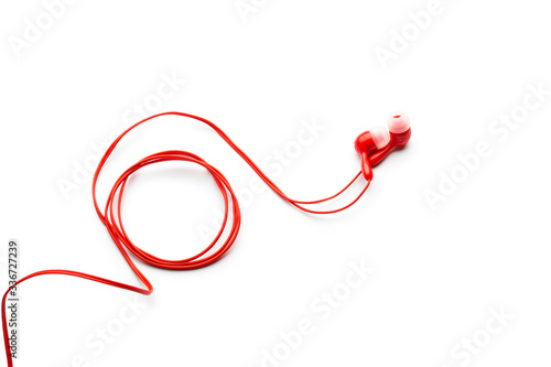 Modern wired classic red headphones isolated on white