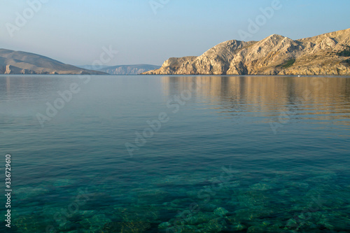 Croatian beach at a sunny morning. Island Krk. Adriatic coast. Europe. Summer vacation. Relaxation Concept. Beaches of Croatia.