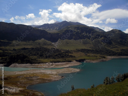Fototapeta Naklejka Na Ścianę i Meble -  View of the lake Roselend, which is mainly a reservoir in the French alpine mountains.