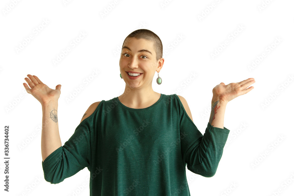 Doesn't know. Portrait of young caucasian woman with freaky appearance on white background. Unusual look with tattoos and bald. Human emotions, facial expression,sales, ad concept. Youth culture. Doesn't know. Portrait of young caucasian woman with freaky appearance on white background. Unusual look with tattoos and bald. Human emotions, facial expression,sales, ad concept. Youth culture.