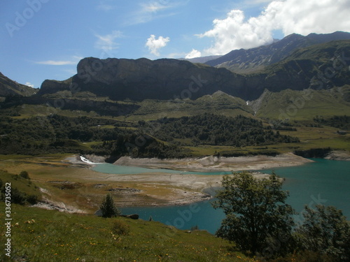 The mountain 'Rocher du vent' (Wind rock), reaching 2,360 meters above sea level, located at the foot of Roselend Lake.