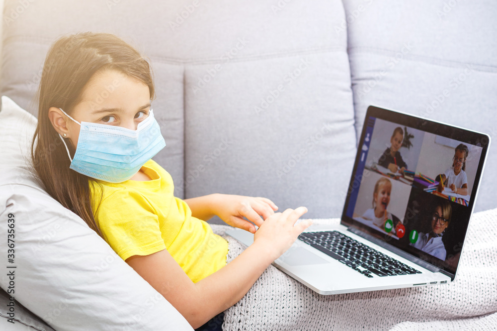 Coronavirus home school concept, quarantine. Girl doing homework. Modern lifestyle Coronavirus home school concept, quarantine. Girl doing homework. Modern lifestyle