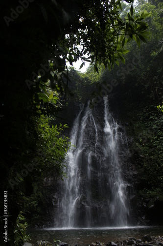 a beautiful waterfall at the foot of the mountain