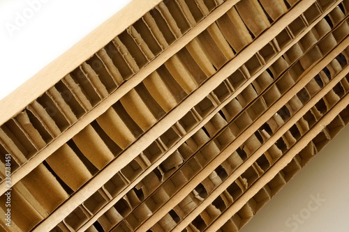 Sheets of brown corrugated cardboard used for filling in fragile parcels.