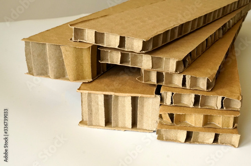 Sheets of brown corrugated cardboard used for filling in fragile parcels. photo