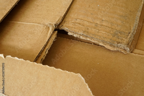 Close-up of stacked corrugated cardboard. Sheets of brown corrugated cardboard.
