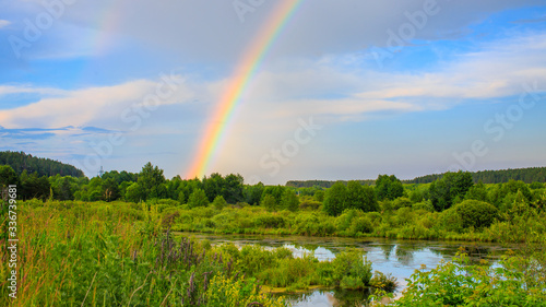 rainbow over the lake and forest