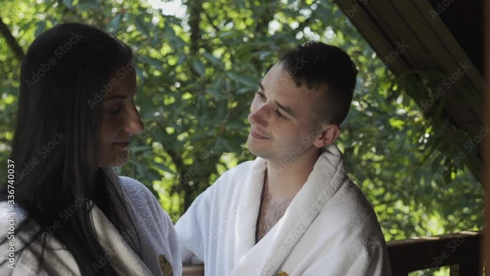 husband and wife drink coffee on the balcony in the mountains on vacation husband and wife drink coffee on the balcony in the mountains on vacation