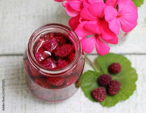 My grandmother's jam styling a blackberry jam in a glass jar