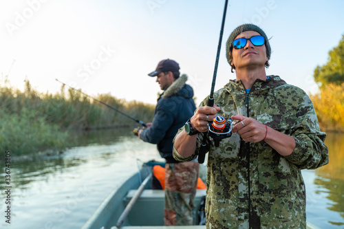 Anglers in the boat on the river