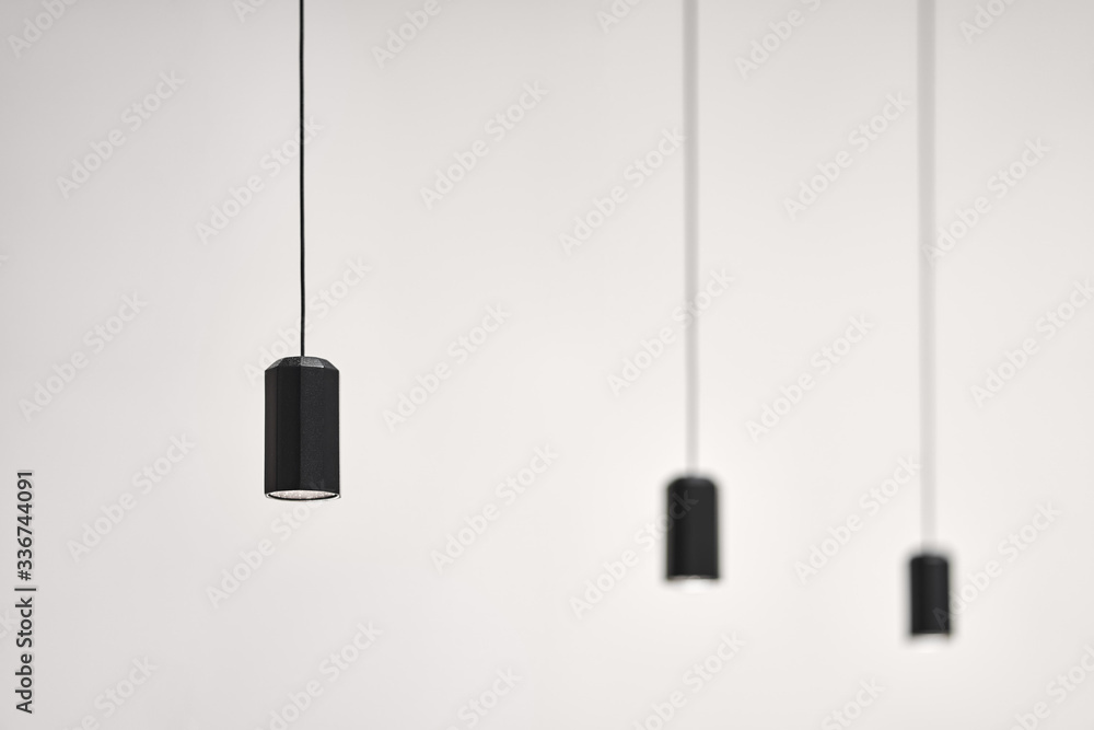 Hanging illuminated dark lamps on blurred background Hanging illuminated dark lamps on blurred background