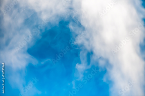 closeup steam from the air humidifier on blue background. health, disease prevention