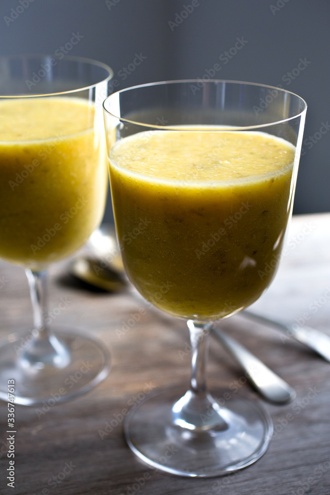 Glasses of coconut pineapple pumpkin seed smoothie Glasses of coconut pineapple pumpkin seed smoothie