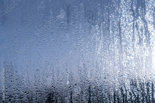 Blurred natural water drop window textured glass . © aquar