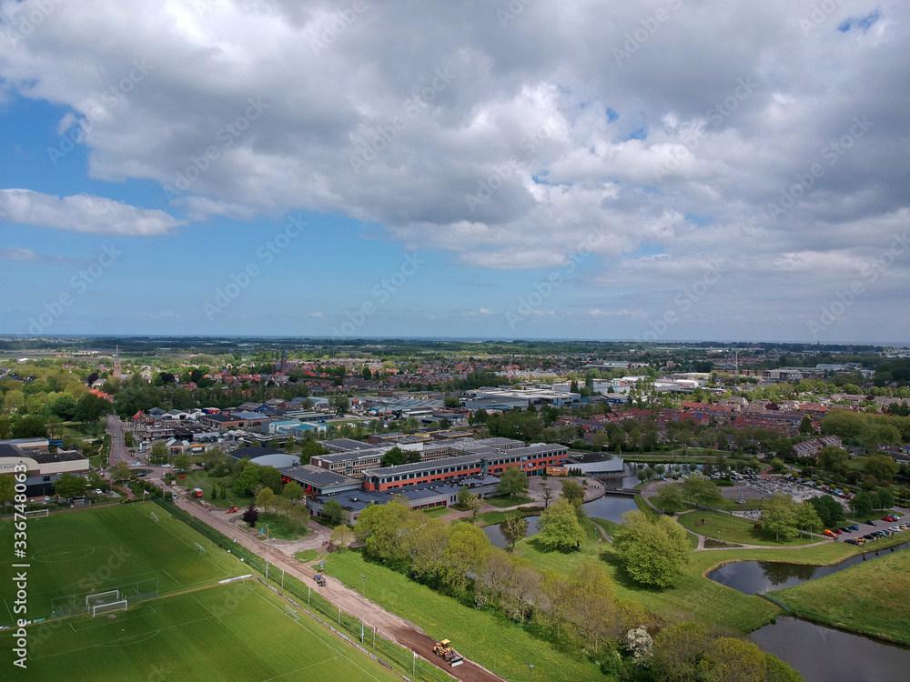 Drone Aerial view  of soccer fields and the buildings of the village of Grootebroek, which is part of urban planning. Photo make with a  drone 