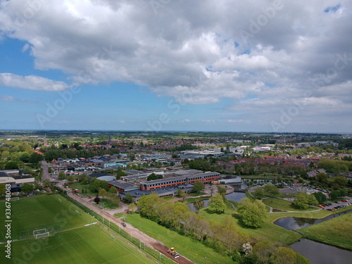 Drone Aerial view of soccer fields and the buildings of the village of Grootebroek, which is part of urban planning. Photo make with a drone 