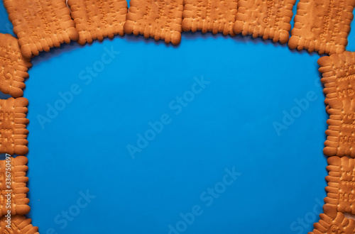 composition biscuits on a blue background lay flat top view photo