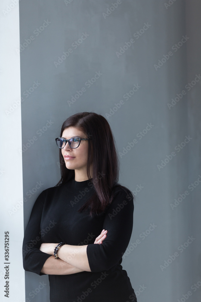 Shot of business woman in black dress talking on phone Shot of business woman in black dress talking on phone