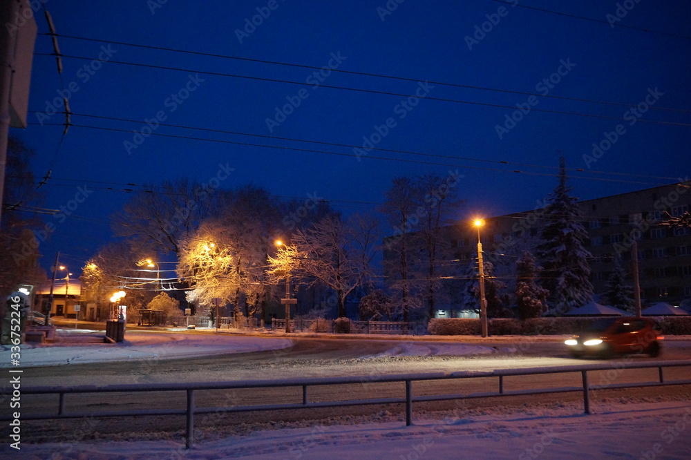 Snowy winter city in the night.