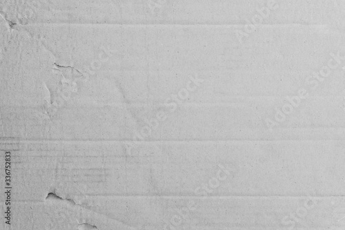 Old grey eco crumpled crate paper kraft background texture in soft white light color concept for page wallpaper design  gray rice matte organic pattern for decorative wall. Vintage decoration flat.