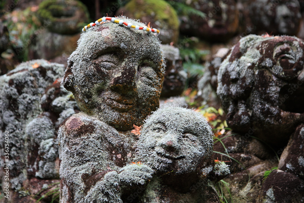 Fototapeta premium Jizō (Japanese stone statues) at Otagi Nenbutu-ji temple in kyoto Japan