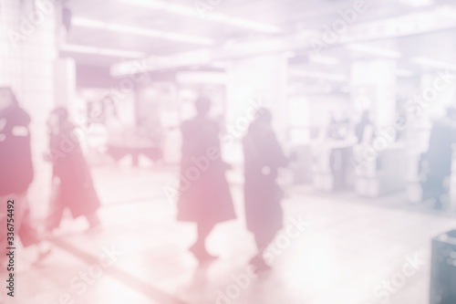 White Blurred People in the Subway Background.