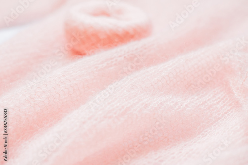 fluffy, knitted peach color texture