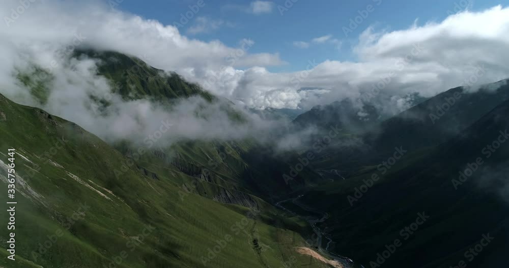 Aerial View On Kazbegi Mountains And Clouds, Caucasus Mountains In Georgia Aerial View On Kazbegi Mountains And Clouds, Caucasus Mountains In Georgia