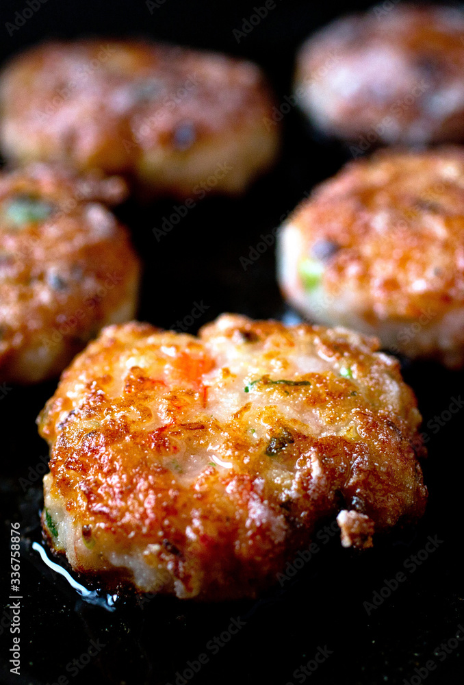 Vietnamese style crispy shrimp cakes being fried Vietnamese style crispy shrimp cakes being fried