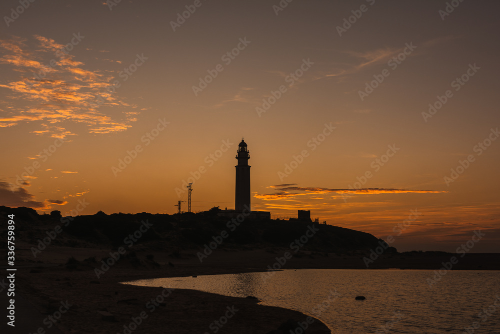 Amazing landscape of lighthouse trafalgar in cadiz at sunset nigth with light
