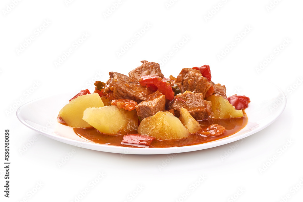 Hungarian goulash, pork stew with potatoes, isolated on white background Hungarian goulash, pork stew with potatoes, isolated on white background