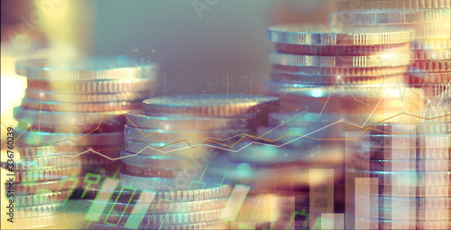 Financial investment concept, Double exposure of city night and stack of coins for finance investor, Forex trading candlestick chart, Cryptocurrency Digital economy. background for invest, recession.