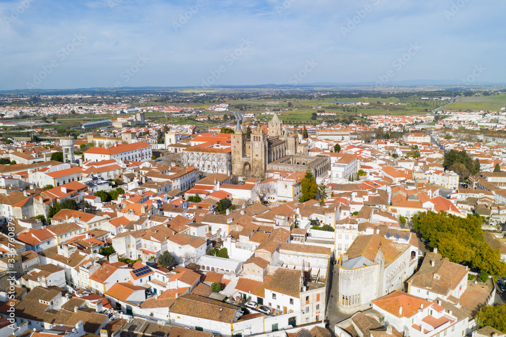 Evora drone aerial view on a sunny day with historic buildings city center and church in Alentejo, Portugal