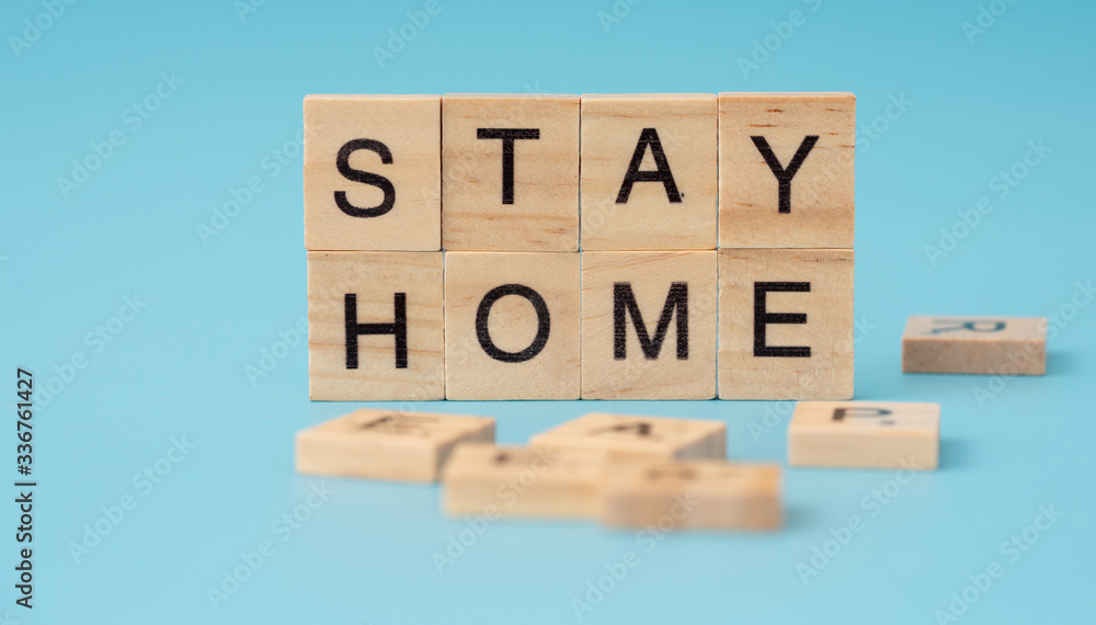 Stay home. corona infection concept. Letter of wooden blocks