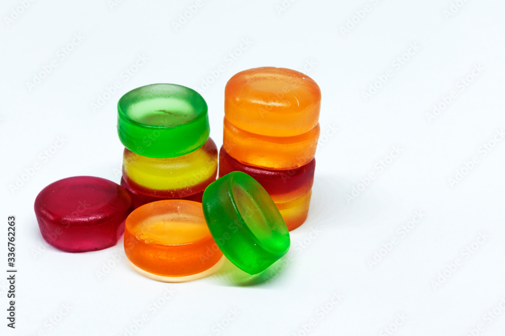 a pile of soft and colorful candies on white background
