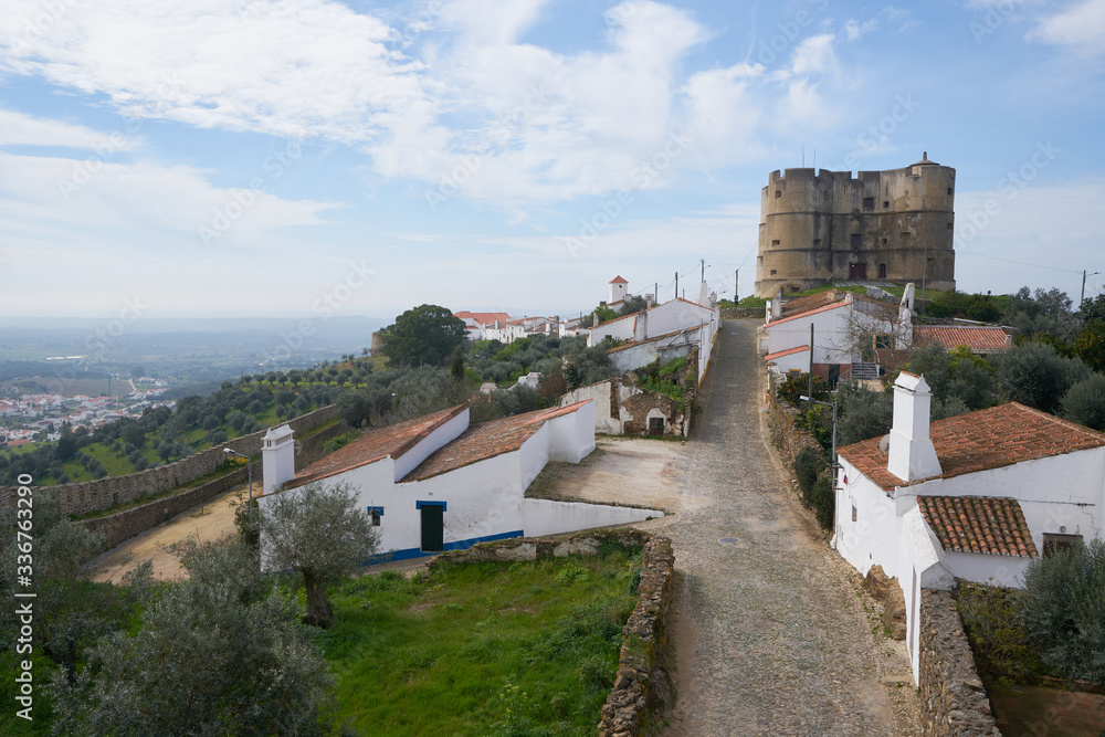 Evoramonte city castle wall historic buildings and olive trees park in Alentejo, Portugal