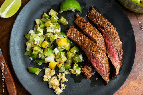 Grilled flank steak with tomatillo pineapple salsa photo