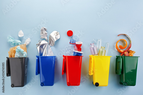 Garbage recycling in flat style on blue background. Garbage collection.